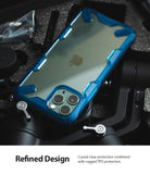 iPhone 11 Pro Case | Fusion-X - A clear iPhone 11 Pro with a blue rugged TPU bumper case resting on camera equipment.