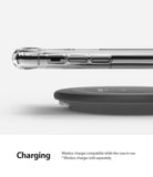 iPhone 11 Pro Max Case | Fusion Design - Clear phone case on an iPhone hovering above a black wireless charging pad.