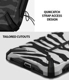 iPhone XS Max Case | Dual-X Design - Close-up of QuikCatch strap hole and precise charging port cutouts on a tiger-striped phone case.