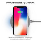 iPhone X Case | Slim + Slot Card Holder - iPhone X in a white case charging wirelessly on a grey Qi pad.