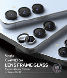 Galaxy S24 FE | Camera Lens Frame Glass - Black protective rings being applied to the camera lenses of a light blue phone.