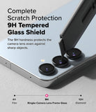 Galaxy S24 FE | Camera Lens Frame Glass - A utility knife scrapes a 9H tempered glass camera lens protector on a phone.