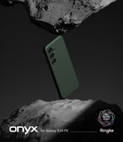 Galaxy S24 FE Case | Onyx - Dark green phone case floating between two rough, grey rock formations against a dark background.
