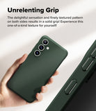 Galaxy S24 FE Case | Onyx - Hand holding a dark green phone case with a textured side grip and triple camera cutout.