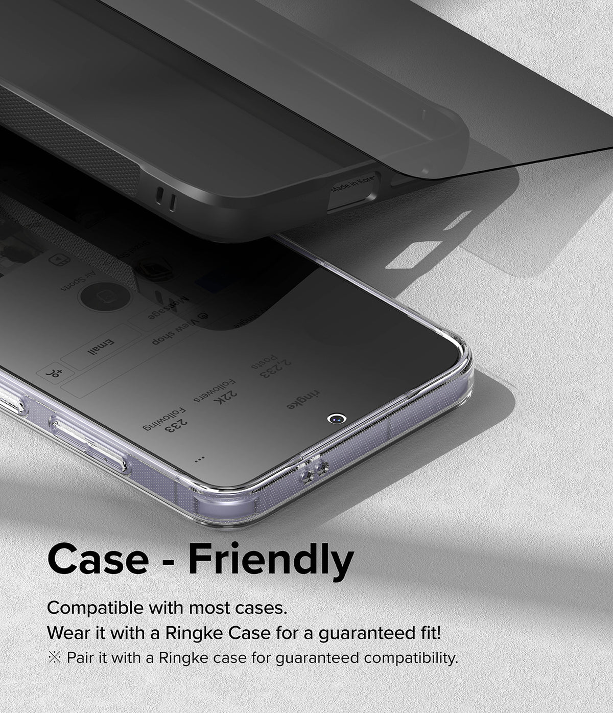 Galaxy S24 Screen Protector | Easy Slide Privacy Tempered Glass - Galaxy S24 Screen Protector - Privacy glass hovering above a smartphone in a protective case, showing case compatibility.