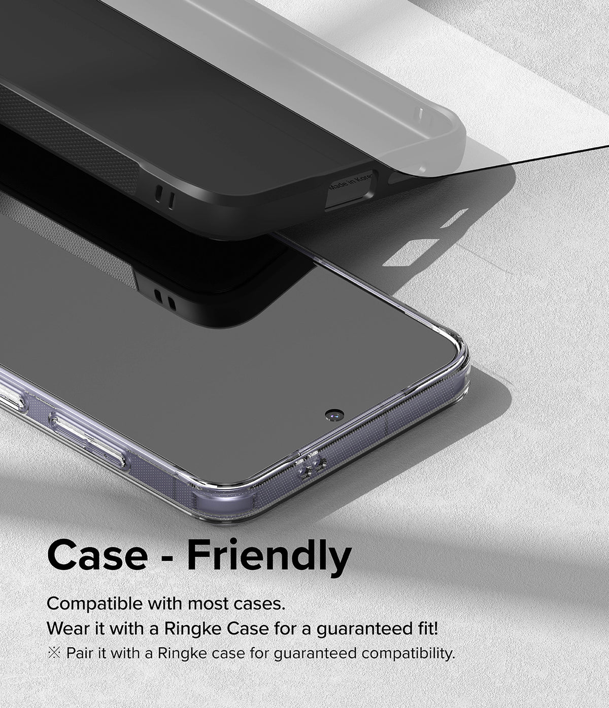 Galaxy S24 Screen Protector | Easy Slide Tempered Glass - Tempered glass screen protector hovering over a phone in a case.