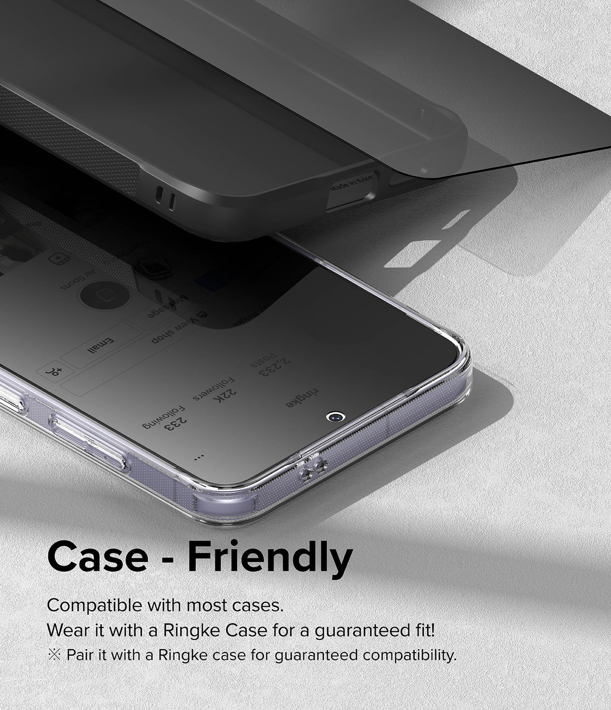 Galaxy S24 Plus Screen Protector | Easy Slide Privacy Tempered Glass - Galaxy S24 Plus Screen Protector - Privacy glass hovering above a smartphone in a clear case, demonstrating case fit.