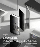 Galaxy S25 Edge Screen Protector | Easy Slide Privacy Tempered Glass - Privacy tempered glass being applied to a smartphone screen on a gray surface.