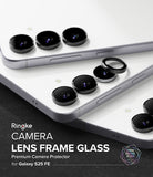 Galaxy S25 FE | Camera Lens Frame Glass - Galaxy S25 FE - Three white smartphones showing black camera lens frame glass protectors being applied to the lenses.
