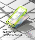 Galaxy S25 FE Screen Protector | Easy Slide Tempered Glass (2P) - Galaxy S25 FE Screen Protector - Neon green installation tray aligning tempered glass onto a Galaxy S25 FE smartphone.