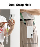 Galaxy S25 FE Case | Fusion Matte - A phone case with dual strap holes shown held in hand and worn crossbody with a lanyard.