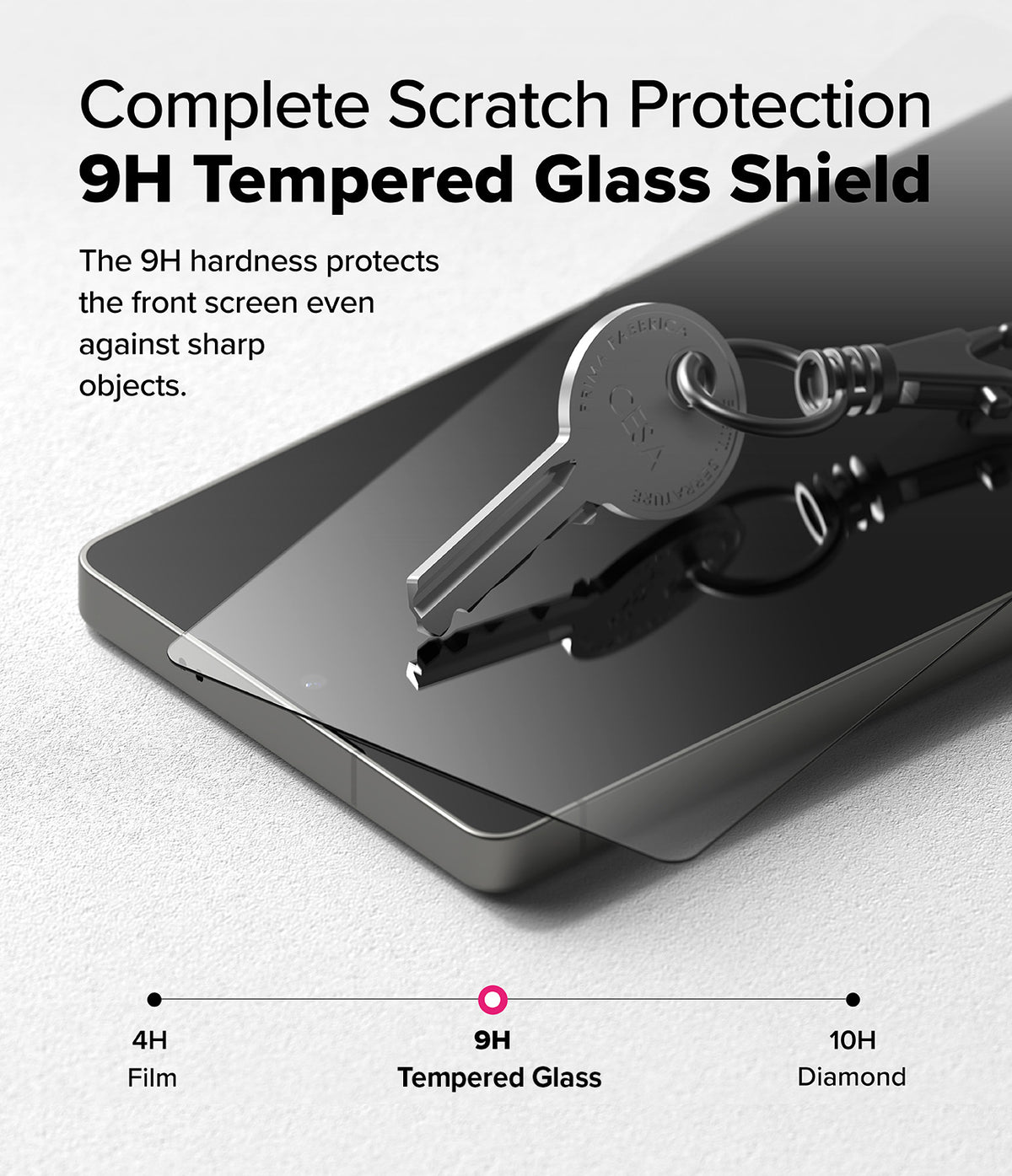 [Bundle] Galaxy S25 Ultra | Rugged Gear Magnetic - A metal key resting on a smartphone screen protected by 9H tempered glass.
