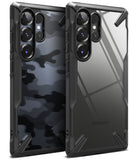 Galaxy S25 Ultra Case | Fusion-X - Two rugged black phone cases, one with a camo pattern and one clear, showing camera cutouts.