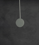 Galaxy S25 Ultra Case | Fusion Magnetic Matte - A magnetic charger snaps onto the back of a matte black phone case.