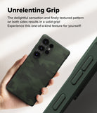 Galaxy S25 Ultra Case | Onyx - Hand holding a dark green textured phone case with a camo pattern and side grip details.