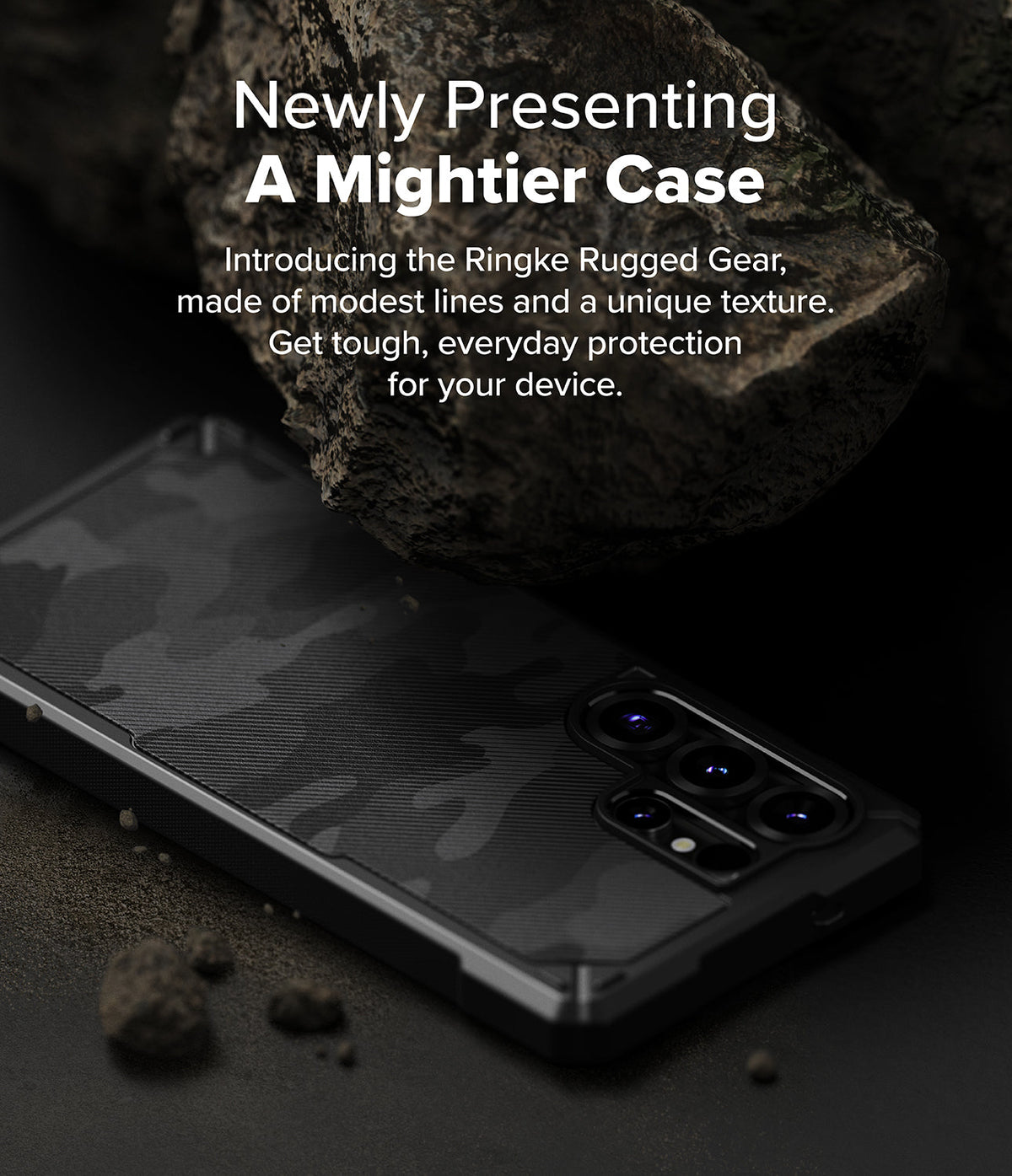 Galaxy S25 Ultra Case | Rugged Gear - Black camouflage phone case resting on dark ground near a large, textured rock.