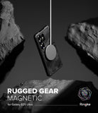 Galaxy S25 Ultra Case | Rugged Gear Magnetic - Black rugged phone case suspended by a magnetic charger between rocks.