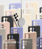 Galaxy S25 Ultra Case | Silicone Magnetic - A beige magnetic phone case suspended by a charger among various colored cases.