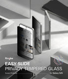 [Bundle] Galaxy S25 | Fusion Magnetic - Galaxy S25 | Fusion Magnetic - Privacy screen protector being applied to a Galaxy S25 smartphone on a gray surface.