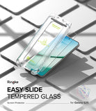 Galaxy S25 Screen Protector | Easy Slide Tempered Glass - Galaxy S25 Screen Protector - Clear installation tray hovering over a Galaxy S25 smartphone on a grid of phone outlines.
