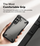 Galaxy S25 Plus Case | Fusion-X - Hand holding a black phone case with a textured, non-slip dot pattern on the side edges.