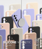 [Bundle] Galaxy S25 Plus | Silicone Magnetic - A purple magnetic phone case suspended by a charger among various colored cases.