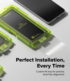 Galaxy S26 FE Screen Protector | Easy Slide Tempered Glass (2P) - A close-up promotional shot of a bright translucent neon green phone screen protector tray being used to place a clear screen protector onto a smartphone. The image includes marketing text that reads 'Perfect Installation, Every Time' and 'Custom-fit tray for precise, dust-free alignment.