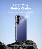 Bundle 15% Galaxy S26 FE Case | Fusion all-groups - A clear protective phone case shown on a Samsung smartphone, standing on dark rocks against a blue sky background. White text at the top reads 'Brighter & Better Clarity' and says to showcase the device's original design.