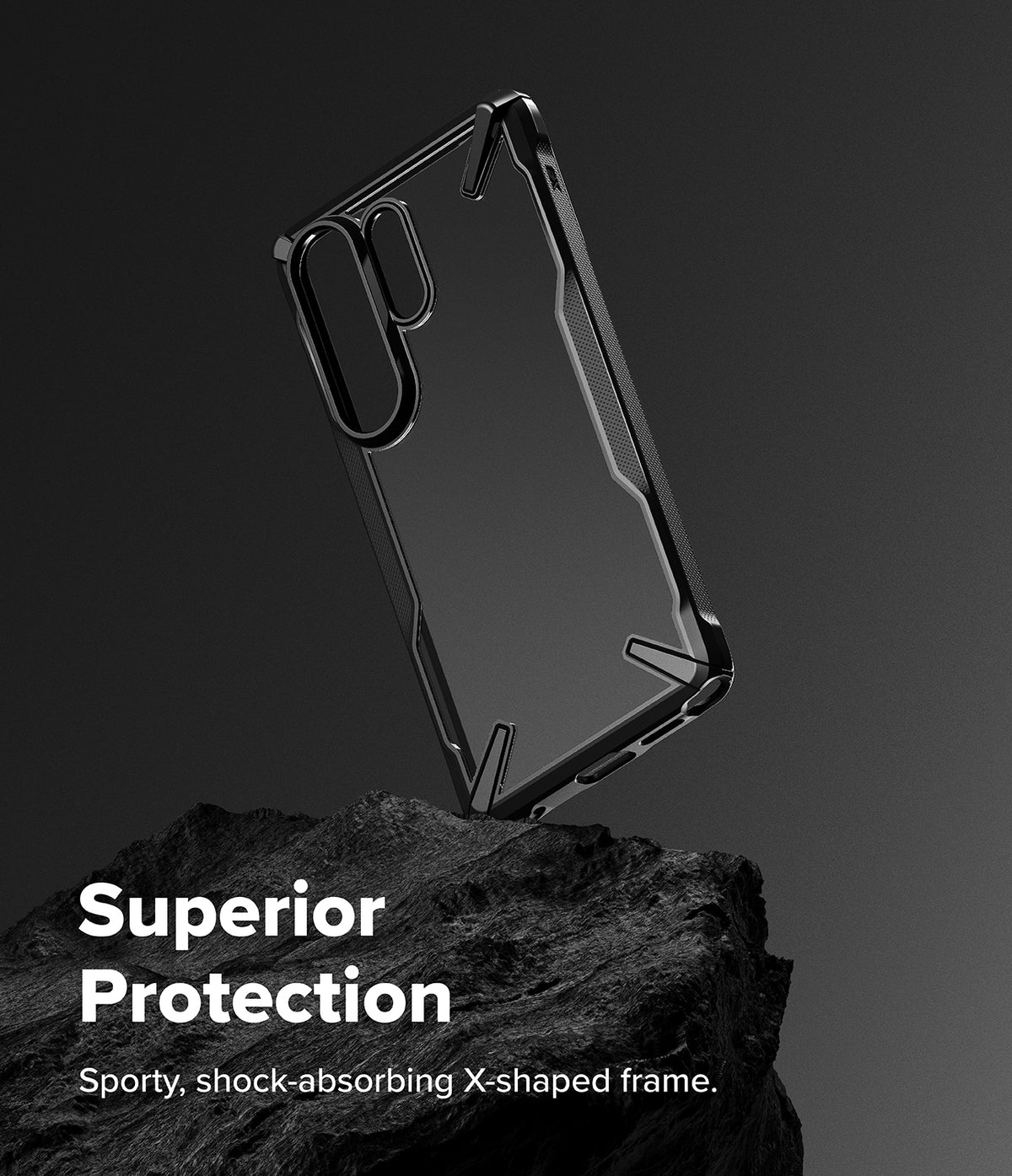 Galaxy S26 Ultra Case | Fusion-X - Black protective phone case with X-shaped frame resting on a dark rock against a grey background.
