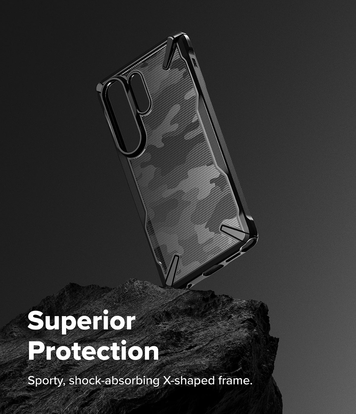 Galaxy S26 Ultra Case | Fusion-X - Camouflage patterned phone case with a rugged black frame resting on a dark rock.