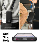 Galaxy S26 Ultra Case | Onyx α - Black phone case with dual strap holes shown worn on a lanyard and attached to a ladder.