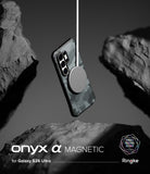 [Bundle] Galaxy S26 Ultra | Onyx α Magnetic - Camo-patterned phone case floating between rocks with a magnetic charger attached.