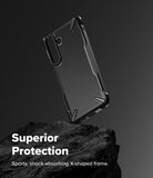 Galaxy S26 Case | Fusion-X - Black protective phone case with X-shaped frame resting on a dark rock against a grey background.