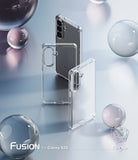 Galaxy S26 Case | Fusion - Two clear phone cases displayed with a smartphone against a reflective surface and glass spheres.