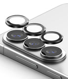 Galaxy S26 Plus / S26 | Camera Lens Frame Glass - Galaxy S26 Plus / S26 - Three black circular camera lens protectors hovering above the smartphone's rear camera array.