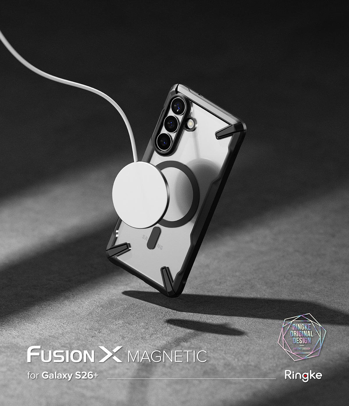 [Bundle] Galaxy S26 Plus | Fusion-X Magnetic - Bundle: Galaxy S26 Plus | Fusion-X Magnetic - A clear Galaxy S26+ case with a magnetic ring attached to a wireless charger.