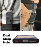 Galaxy S26 Plus Case | Onyx Magnetic - Black camo phone case with dual strap holes shown worn and on a ladder.