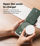 Card Holder | Slide Grip Wallet Magnetic - Hands holding a phone with an open green magnetic wallet while attaching a charger.