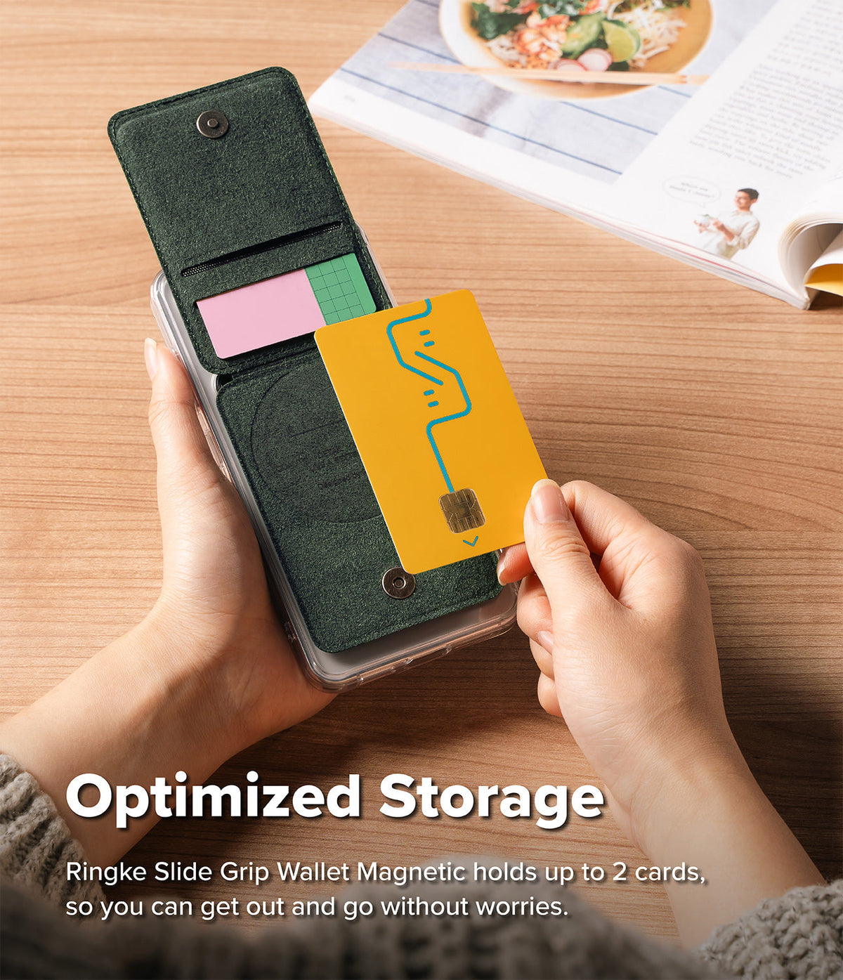 Card Holder | Slide Grip Wallet Magnetic - Hands holding a dark green magnetic wallet attached to a phone, inserting a yellow card.