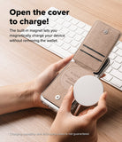 Card Holder | Slide Grip Wallet Magnetic - Hands holding a phone with an open magnetic wallet case while attaching a charger.