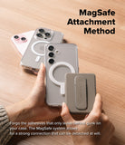 Card Holder | Slide Grip Wallet Magnetic - Hands attaching a magnetic gray wallet to a clear phone case on a wood table.