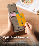 Card Holder | Slide Grip Wallet Magnetic - Hands holding a magnetic phone wallet with two card slots on a wooden desk.