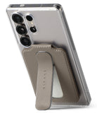 Card Holder | Slide Grip Wallet Magnetic Edge - Card Holder - Taupe magnetic card holder with a slide-out grip stand attached to the back of a clear smartphone case.