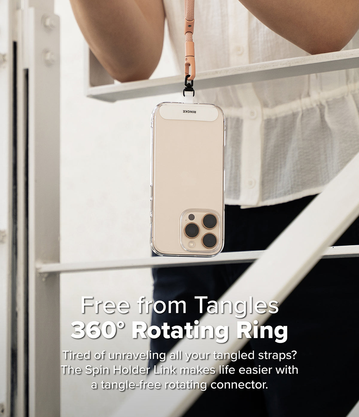 Holder Link Spin - Smartphone hanging from a lanyard with a 360-degree rotating connector to prevent strap tangling.