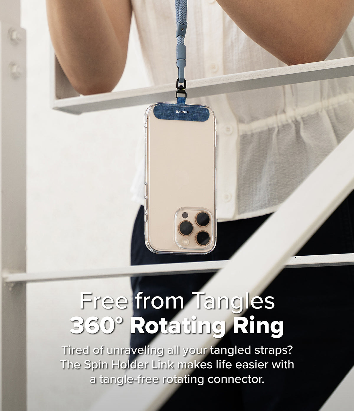 Holder Link Spin - A smartphone hanging from a blue lanyard with a 360-degree rotating connector attached to the case.