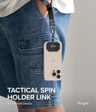 Holder Link Tactical Spin - Smartphone in a clear case attached to a tactical lanyard hanging from blue denim shorts.