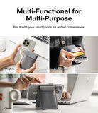 Card Holder | Stand Wallet Magnetic - Grey magnetic wallet attached to a phone, holding a card, and acting as a phone stand.