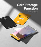Card Holder | Stand Slot - Clear card holder with a flip-up stand holding two cards, plus two loose cards on a grey surface.