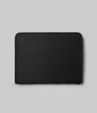 Pad Pouch | Smart Zip Pouch - A minimalist, rectangular black zippered pouch centered on a light gray background.