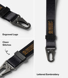 Holder Link Tactical Webbing Hand Strap - Black tactical strap with metal carabiner, engraved logo, and orange embroidery.